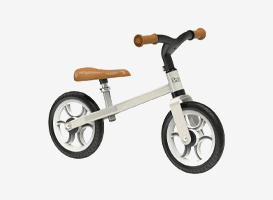 Draisienne enfant beige avec selle et poignées marron, deux grandes roues noires à jantes claires