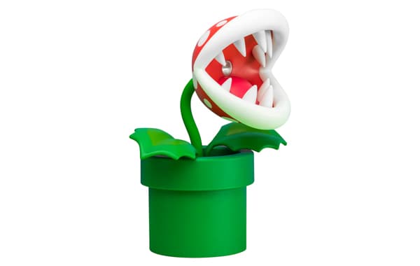 Figur einer Piranha-Pflanze aus einem Videospiel, mit großen weißen Zähnen und roten Kopf, sitzt in einem grünen Blumentopf